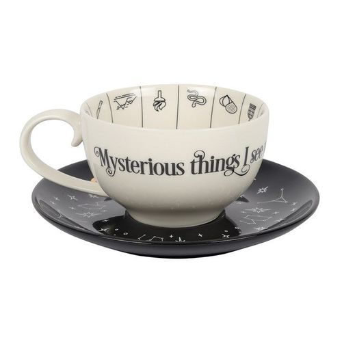 Fortune telling teacup with gold astrology symbols and saucer