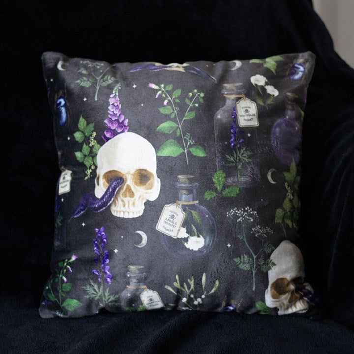 Gothic skull and serpent cushion on sofa setting