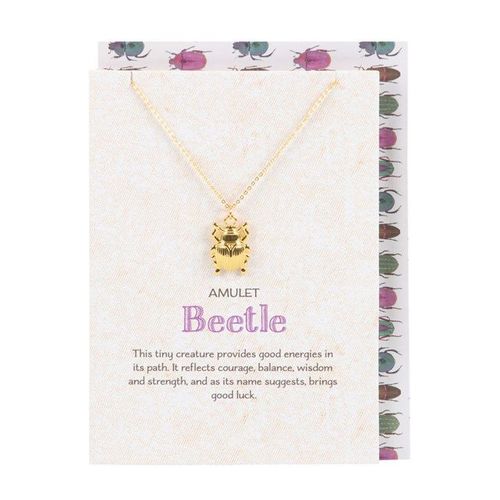 Gold-tone beetle necklace on whimsical greeting card