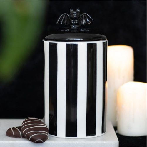 Striped black and white ceramic jar with bat lid handle
