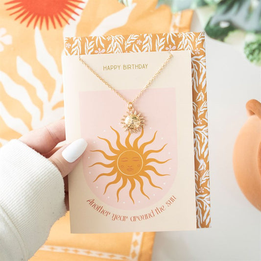 Sun pendant necklace on birthday card with matching envelope
