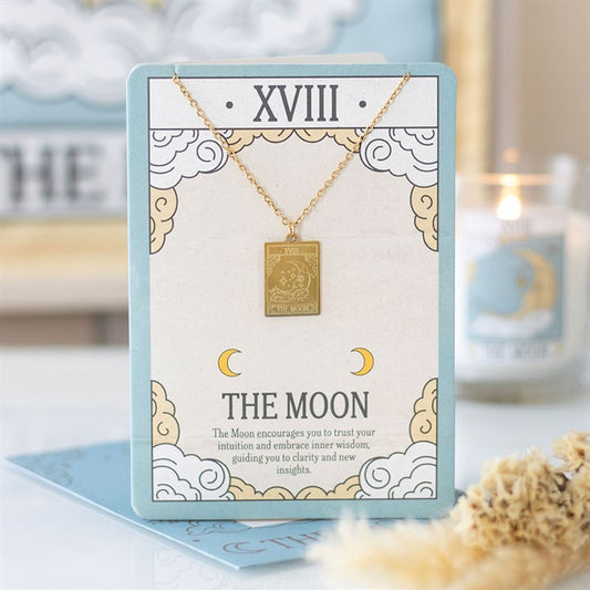 Gold coloured The Moon tarot necklace on greeting card with envelope