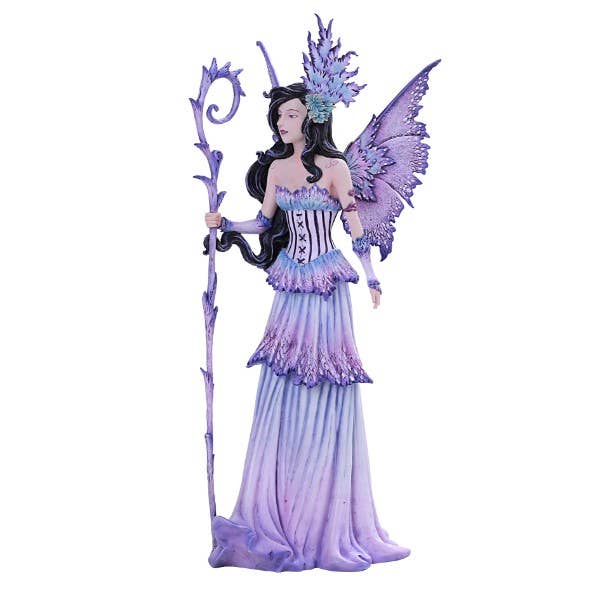 Fantasy fairy figurine with purple dress and wings holding a staff on a white background