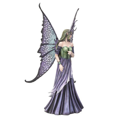 Fairy figurine with purple and green dress and wings on a white background