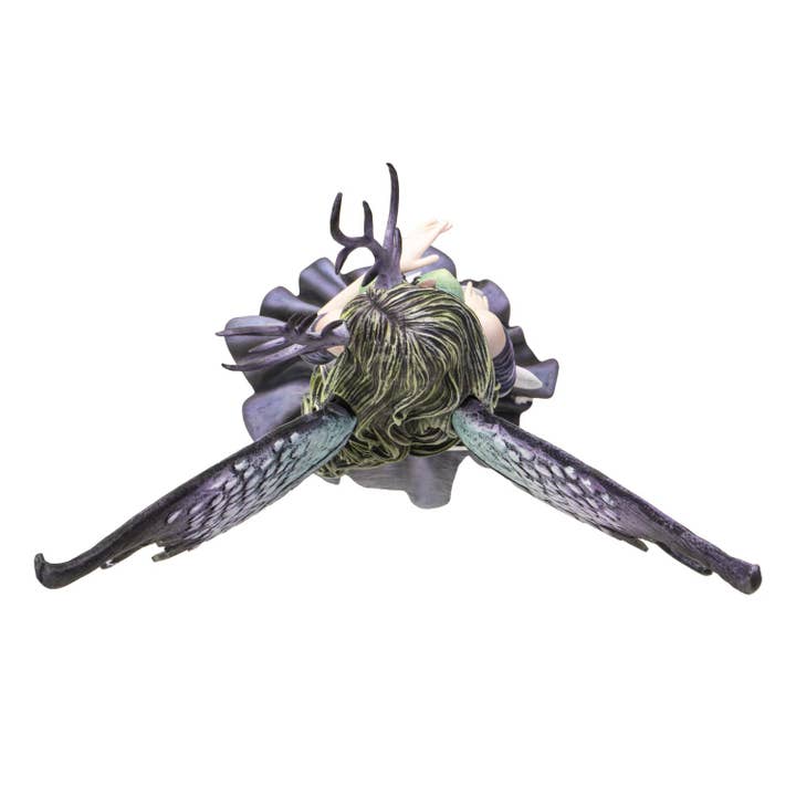 Fantasy creature figurine with large wings and detailed head on a white background