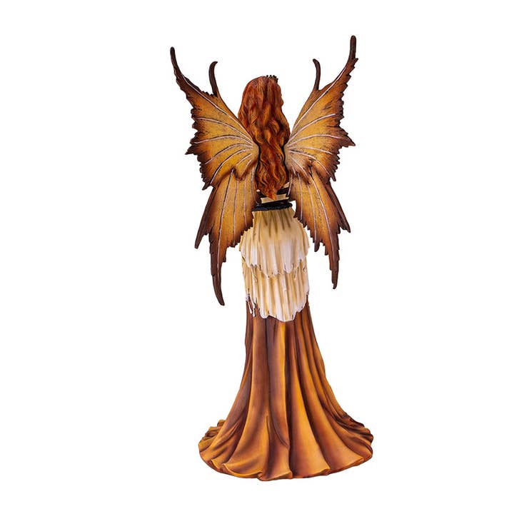Statue of a fairy with butterfly wings on a white background