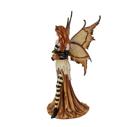 Fantasy figurine of a fairy with butterfly wings on a white background