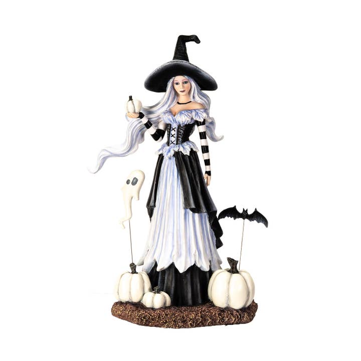 Halloween-themed figurine of a witch with pumpkins and a ghost on a white background