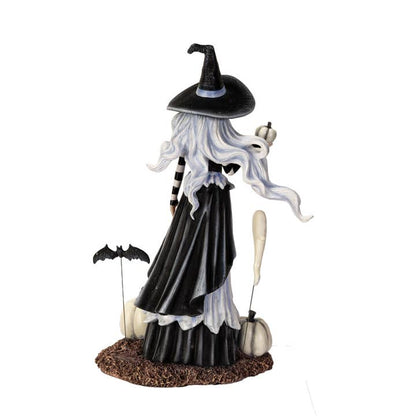 Halloween-themed figurine of a witch with black hat, long white hair, and black dress on a white background.