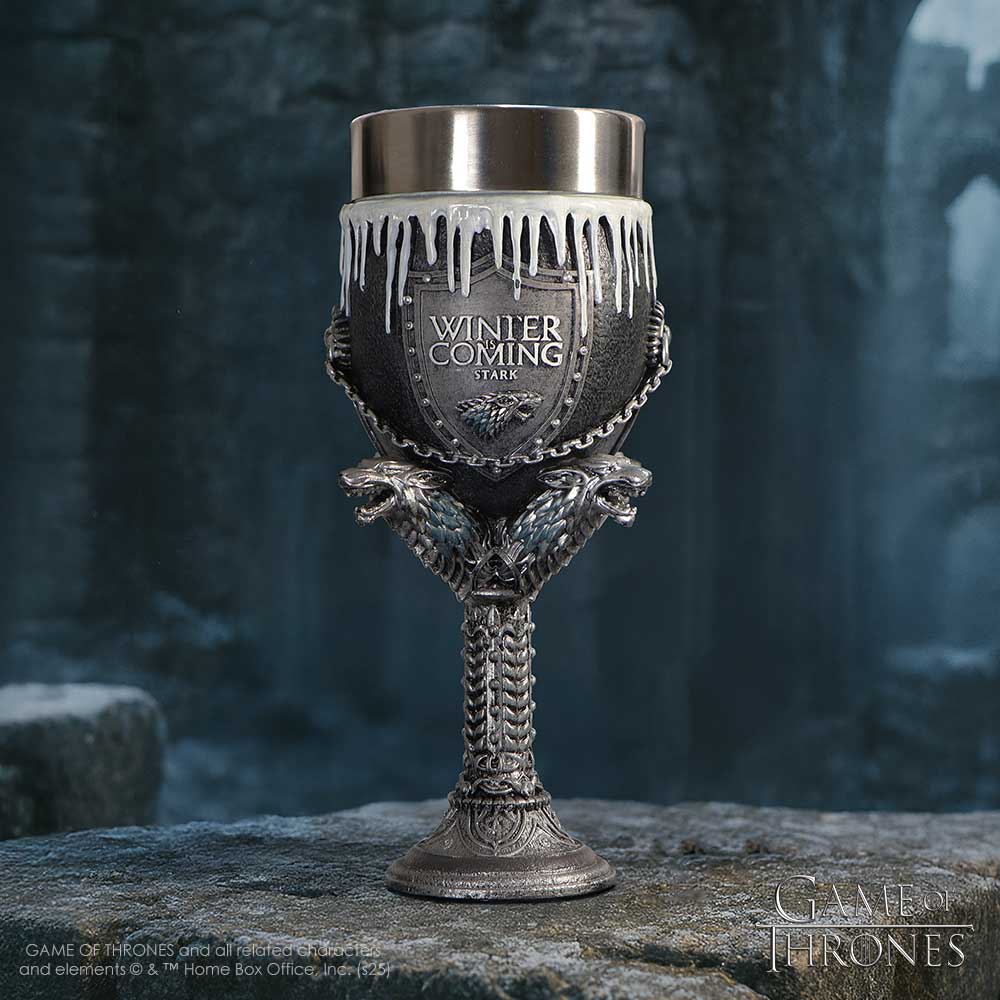 Decorative goblet with 'Winter is Coming' text and 'Stark' emblem on a stone surface with a dark, forest-like background.