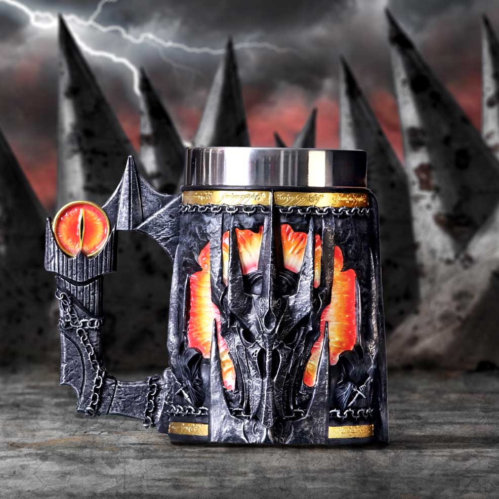 Decorative mug with dragon design and fiery eyes against a dark, stormy background.