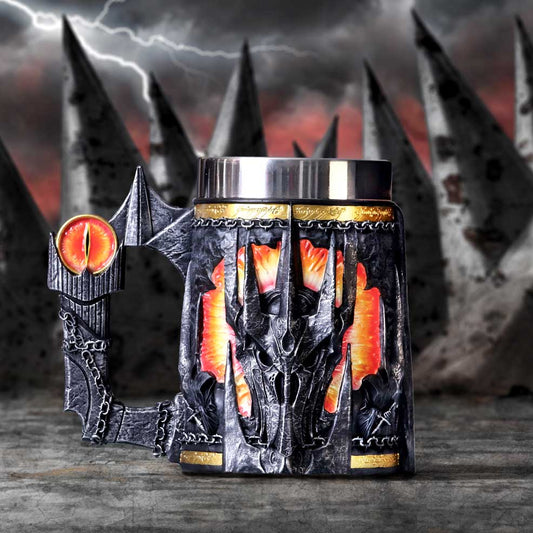 Decorative mug with dragon design and fiery eyes against a dark, stormy background.
