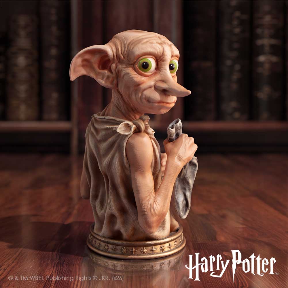 Harry Potter Dobby house-elf bust holding his freedom sock on a star-patterned base, displayed against a library backdrop.