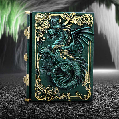 Decorative notebook with a dragon design on a dark surface