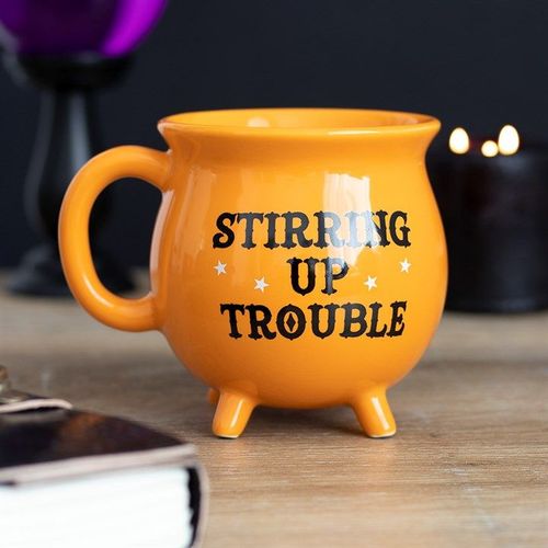 Orange ceramic cauldron mug with Stirring Up Trouble text