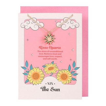 Rose quartz sun necklace on tarot-themed greeting card