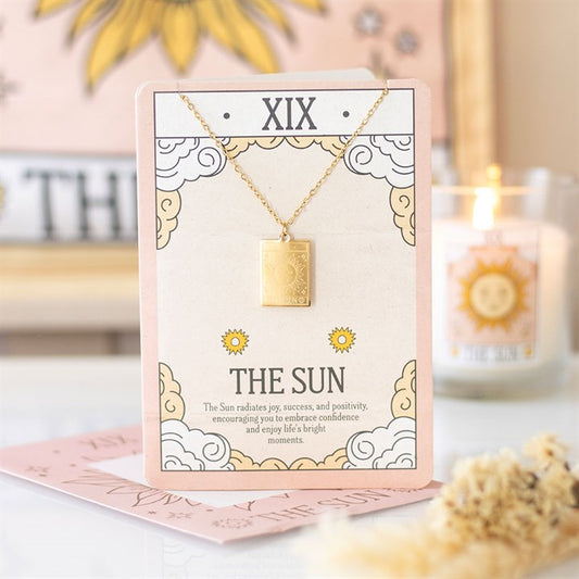 Gold coloured The Sun tarot necklace on illustrated card with envelope